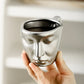 Metal touching face, creative ceramic kiss coffee mug